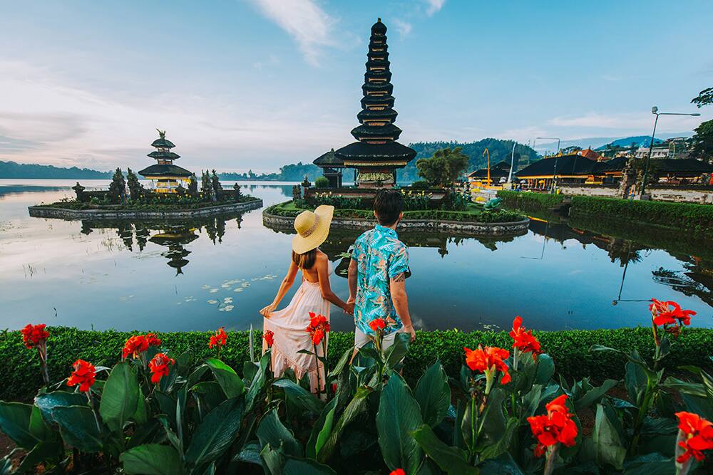 Couple in Ulun Datu Bratan Temple in Bali, Indonesia