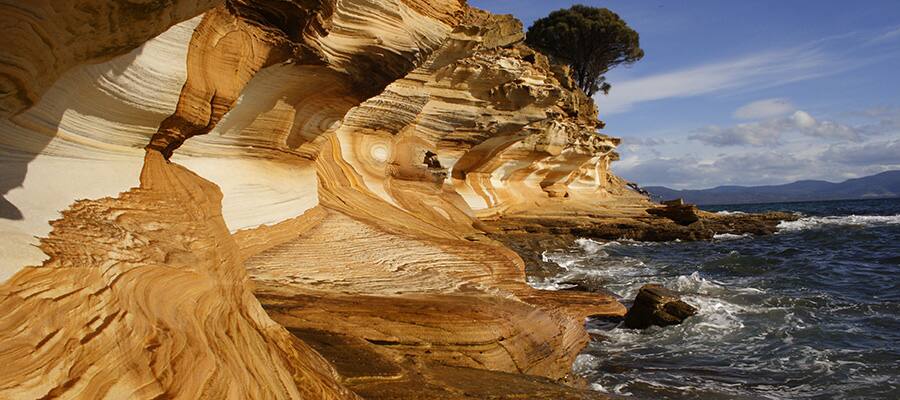 Painted cliff formation on Maria island on Burnie Cruises