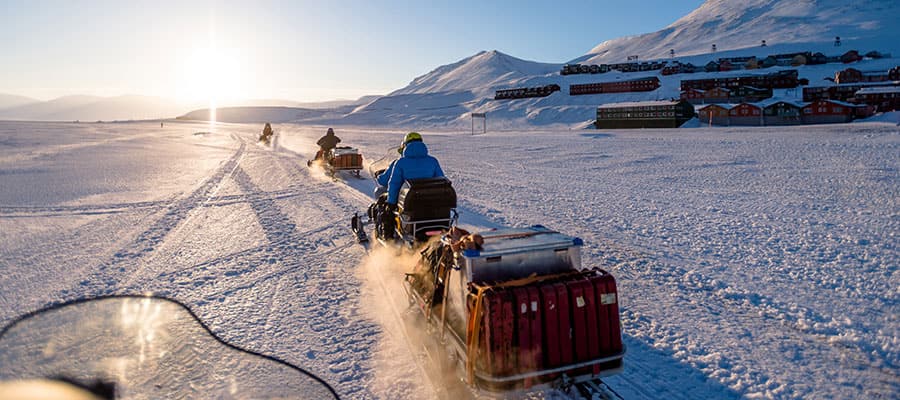 Hop on a snowmobile, the most efficient and fun method of travel