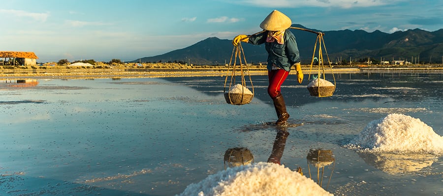 Women carrying salt from salt farm in Nha Trang