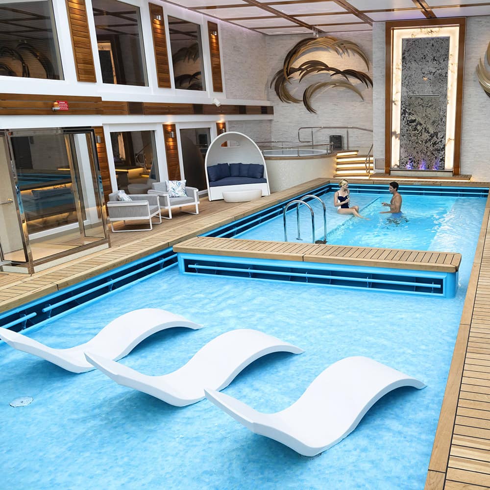 Enjoy a last-minute cruise vacation onboard the top deck of the ship overlooking the pool with a beverage